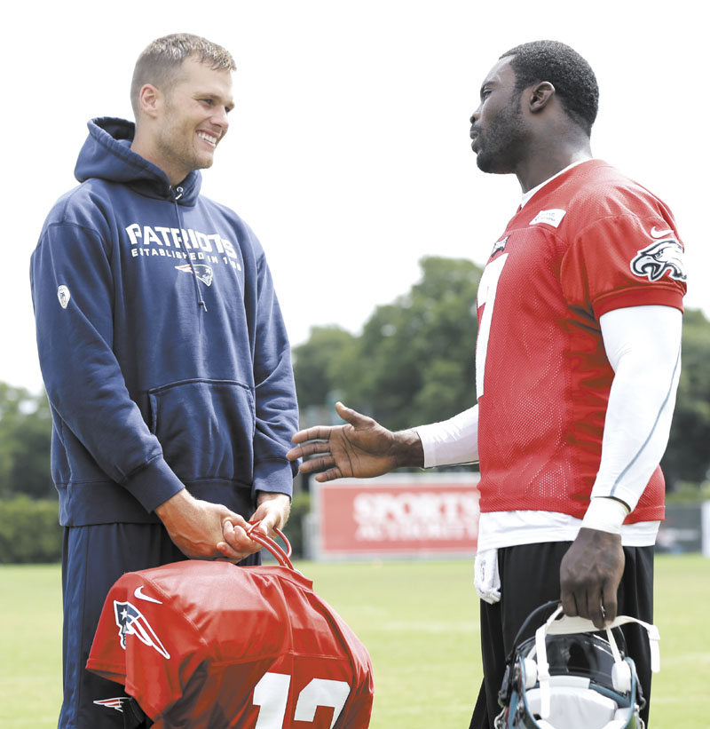 LET’S DO THIS: New England Patriots’ quarterback Tom Brady, left, and Philadelphia Eagles’ quarterback Michael Vick talk during a joint practice Thursday in Philadelphia. The Patriots and Eagles play their first preseason game tonight in Philadelphia.