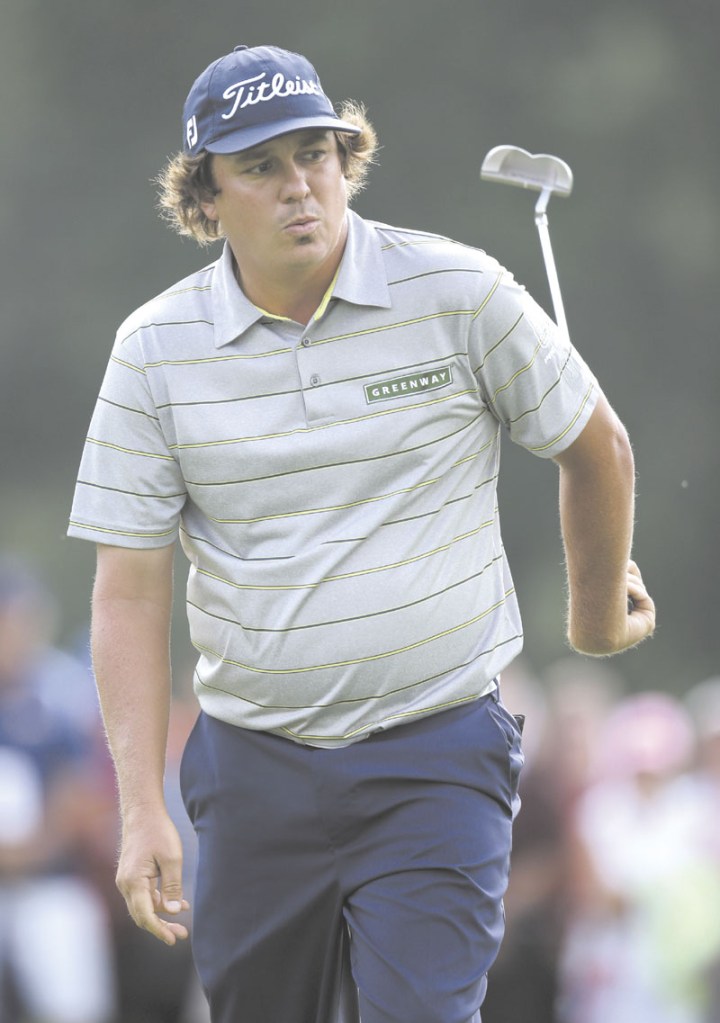STELLAR DAY: Jason Dufner reacts after missing a birdie putt on the 17th hole during the second round of the PGA Championship on Friday at Oak Hill Country Club in Pittsford, N.Y. Dufner shot 63 in the second round and has a two-shot lead. AP photo