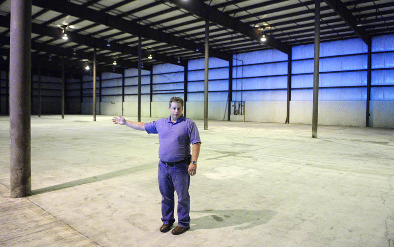 During a tour of proposed new facility, Don Hutchins, fleet manager for the Maine Department of Transportation, talks about plans for moving operations from Capital Street to 66 Industrial Drive in Augusta.