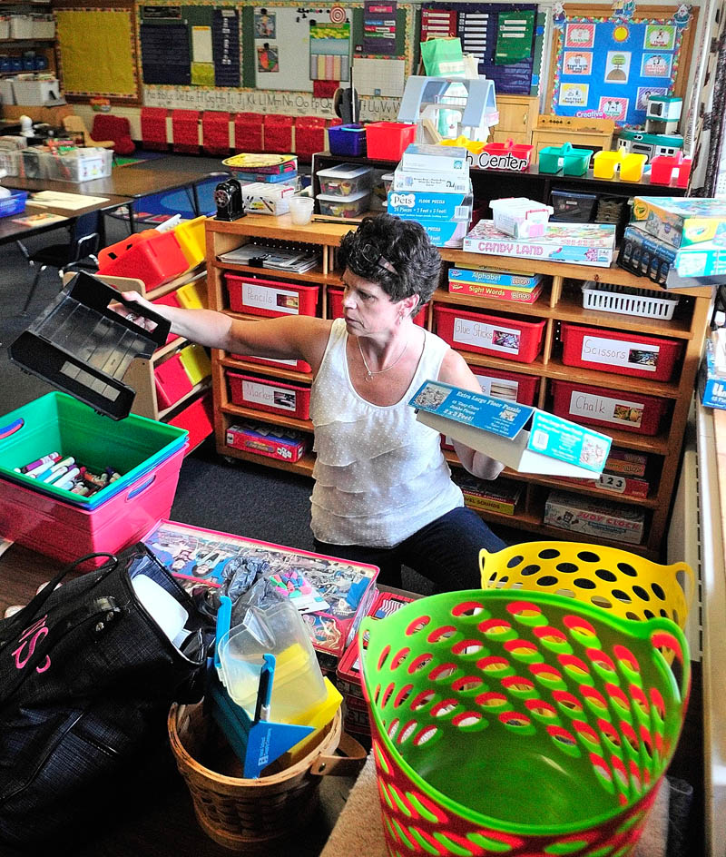 Kindergarten teacher Nancy Stover organizes her classroom on Tuesday at Dresden Elementary School.