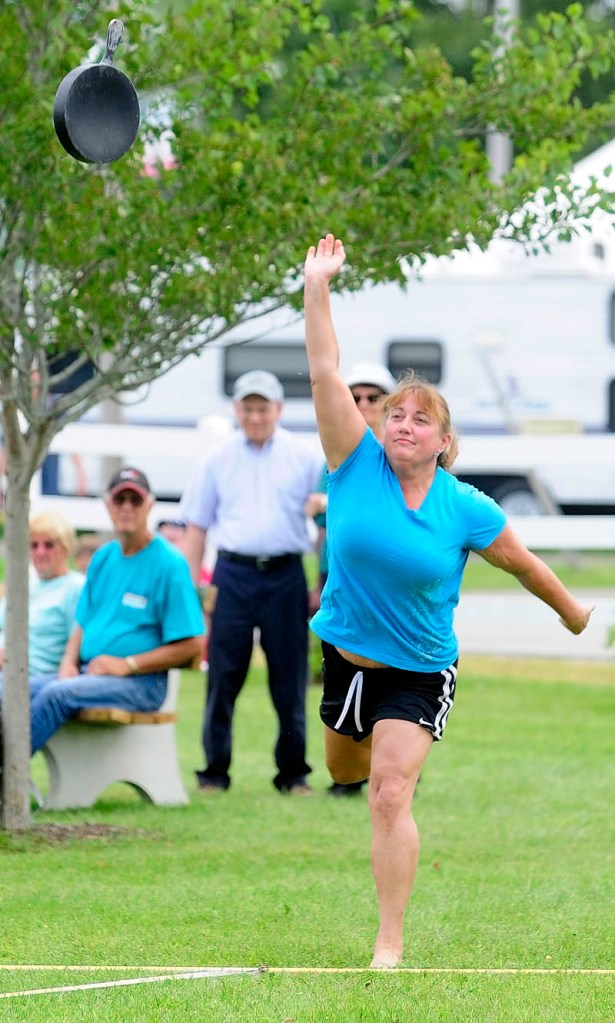 Lori Hawk, 52 of China, competes in the Ladies Fry Pan Throwing Contest today at the Windsor Fair. She took first in her age group.