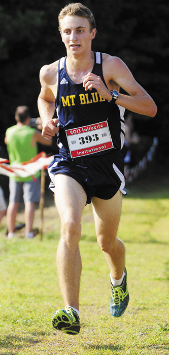 ON THE WAY TO VICTORY: Mt. Blue High School senior Josh Horne runs to victory at the Scot Laliberte Invitational cross country race Friday in Augusta. Horne finished the 2.4 mile course in 13 minutes, 21.95 seconds to beat teammate Aaron Willingham by eight seconds.
