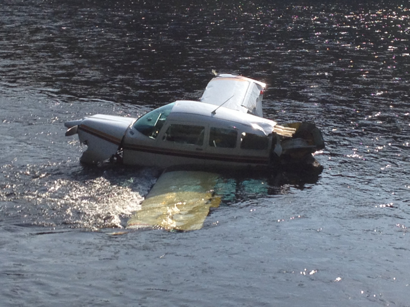 The fuselage of a single-engine Beechcraft airplane is seen in the Kennebec River in Bingham this afternoon. The airplane crashed into the river shortly after taking off from Gadabout Gaddis Airport.