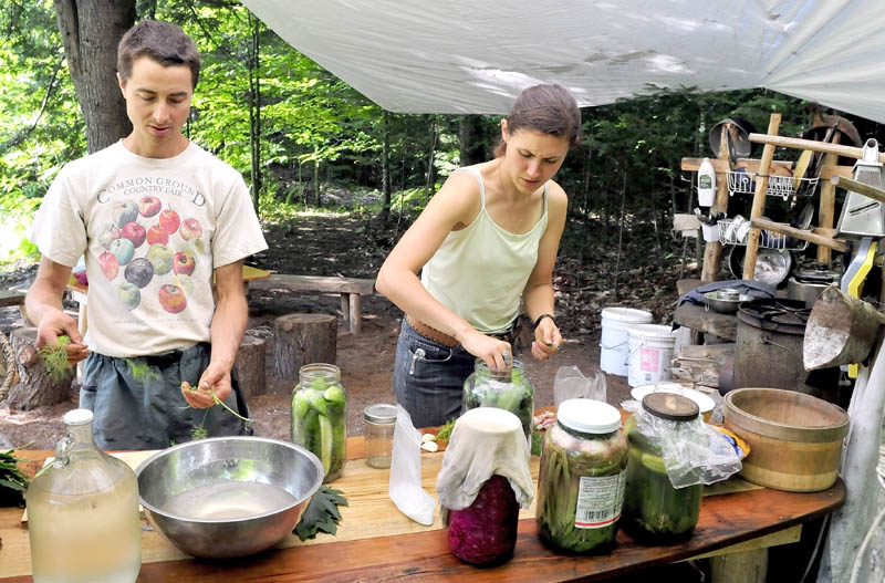 Ashley Hardy learns how to can vegetables from Chris Knapp at the Koviashuvik Living School in Starks recently.