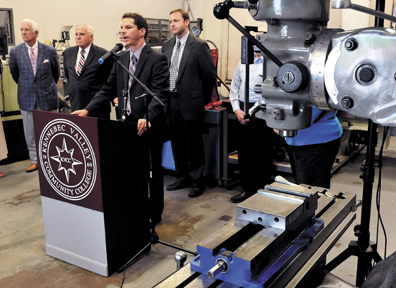 Surrounded by machinist equipment, Maine Senate President Justin Alfond and proponents of a $149.5 million job bond address officials at Kennebec Valley Community College in Fairfield on Wednesday. At left is Dana Connors, president of the Maine Chamber of Commerce, Scott Knapp, president of Central Maine Community College and Speaker of the House Mark Eves.