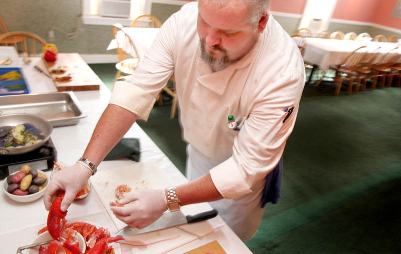 Chef Bob McGowan of The Heritage House in Skowhegan prepares lobster today for a seafood cocktail to be served at the Taste of Greater Waterville on Wednesday.
