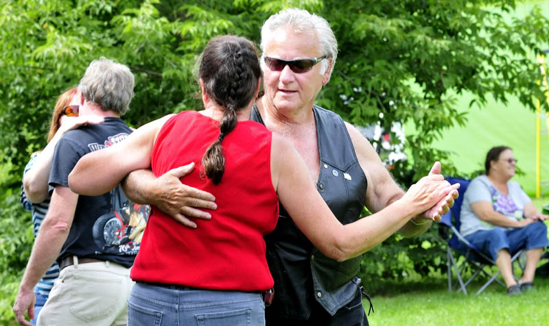 Ted Mills and Kathleen Laffin joined other dancers as the band BorderLine Express played in Fort Halifax Park in Winslow on Sunday during the A Day in the Park for the Arts fundraiser, set up to benefit Winslow High School's performing arts programs.