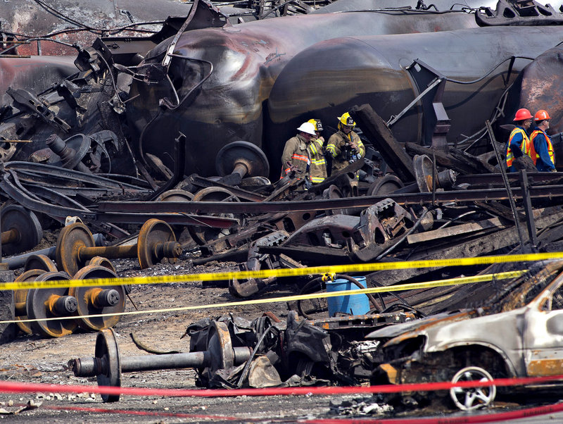 Unions that represent railroad workers are rallying behind Michaud's bill, saying it would help prevent the kind of accident that killed 47 people in Lac-Megantic, Quebec, last month. The industry says the bill is a ploy to protect jobs. Above, workers clean up the deadly Quebec crash.