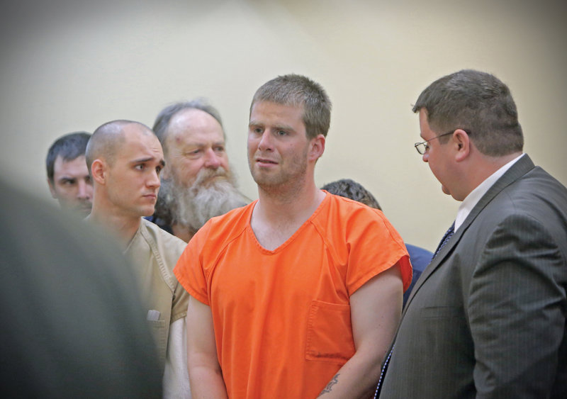Bryan Wood, center, stands next to his attorney Steven Carey, right, during his arraignment in Lewiston District Court on arson charges on May 13. Wood, who has been found incompetent to stand trial, likely will be released at some point after charges are dropped. Brian Morin, left, was also arraigned on arson charges that day.