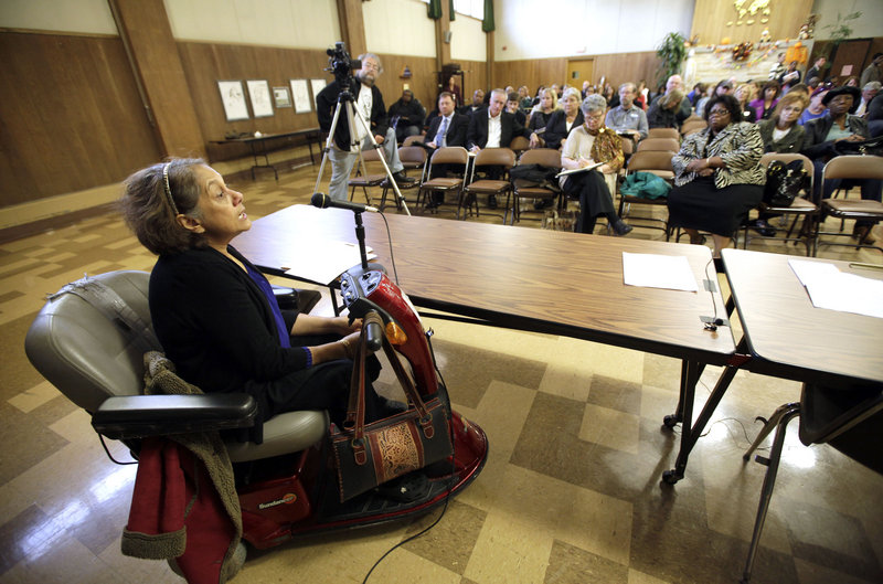 Shirin Cabraal, managing attorney of Disability Rights Wisconsin, addresses the crowd as state senators hold a public hearing into problems with LogistiCare at Washington Park Senior Center in Milwaukee Center on Oct. 18, 2012.