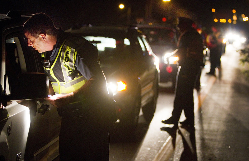 Brunswick Police Officer John Roma and other Cumberland County officers conduct sobriety checks Friday.