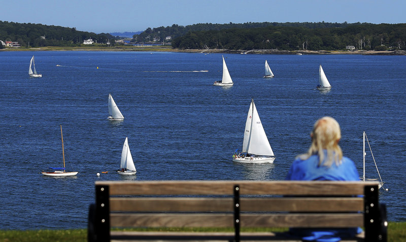 Dolores Wilhoite of Portland watches the MS Regatta from the Eastern Promenade on Saturday.