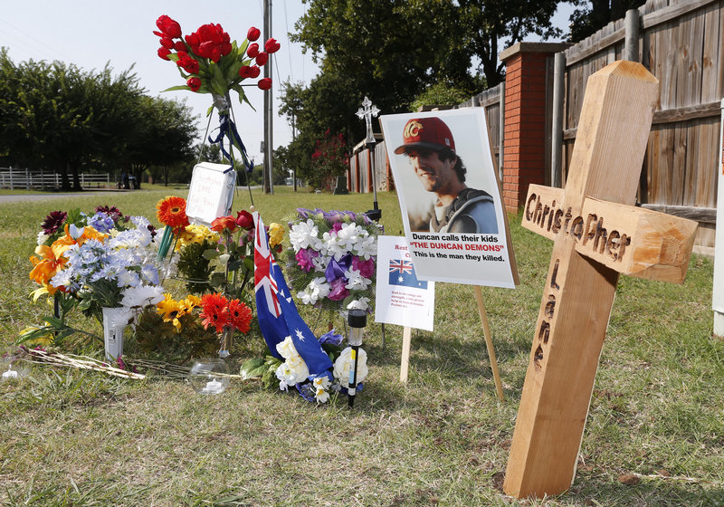 A memorial to Christopher Lane is shown along the road where he was shot and killed in Duncan, Okla. Lane, an Australian who was on a baseball scholarship at East Central University in Ada, Okla., was in Duncan visiting his girlfriend when he was gunned down.