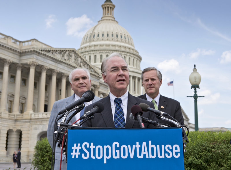 Rep. Tom Price, R-Ga., flanked by Rep. Mike Kelly, R-Pa., left, and Rep. Mark Meadows, R-N.C., urges his party to deny funding to the Affordable Care Act.