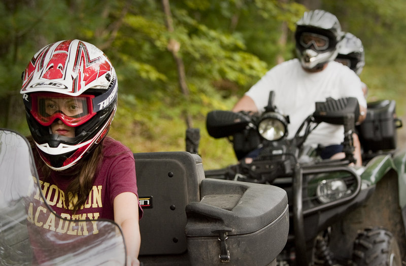 Twelve-year-old Alyssa Lajoie leads the way during a ATV trail ride with her Dad, Jim Lajoie, and his passenger, brother Ian, age 8, near their Dayton home on Monday, August 26, 2013. Alyssa took the training class at age 10 with her mother and was certified to ride on public trails.