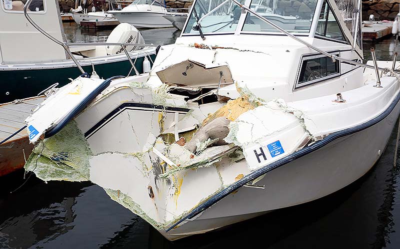 The damaged Miss M, a 20-foot Grady White Overnighter, is docked at Portland Yacht Services in Portland on Sunday. The Miss M and a water taxi collided Saturday night, injuring three people, including Portland financier S. Donald Sussman.