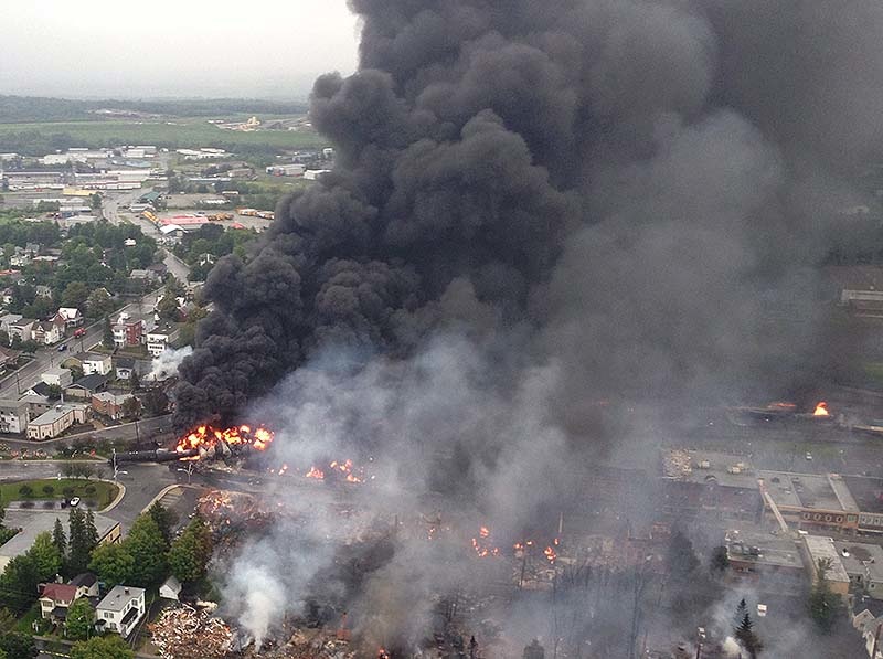 This July 6, 2013, photo shows the fire in Lac-Megantic, Quebec, following the derailment of a Maine, Montreal & Atlantic train transporting oil.
