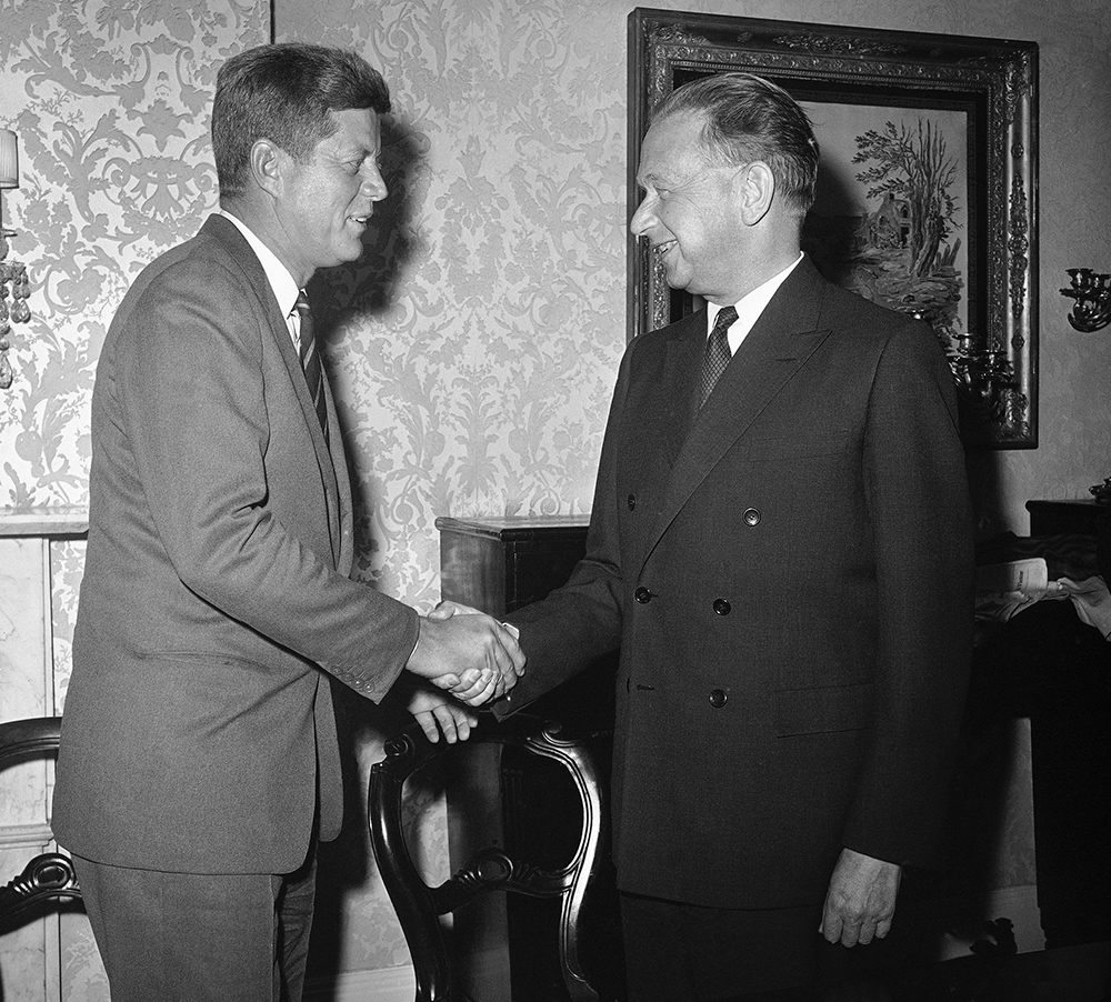 President-elect John F. Kennedy and United Nations secretary-general Dag Hammarskjold are shown at their conference in Kennedy’s suite at the hotel Carlyle in New York City, Dec. 7, 1960. (AP Photo) Smiling Standing Face to Face Authority Greeting