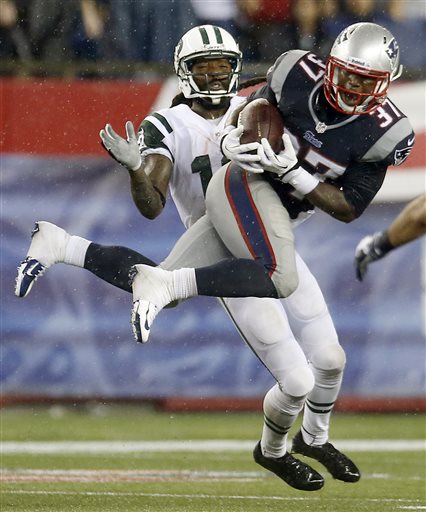 New England Patriots cornerback Alfonzo Dennard (37) intercepts a pass intended for New York Jets wide receiver Clyde Gates, rear, during the fourth quarter of an NFL football game Thursday, Sept. 12, 2013, in Foxborough, Mass. (AP Photo/Elise Amendola) NFLACTION13;