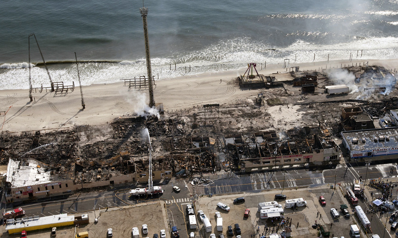 This aerial photo shows the aftermath of a massive fire that burned a large portion of the boardwalk Friday in Seaside Park, N.J.