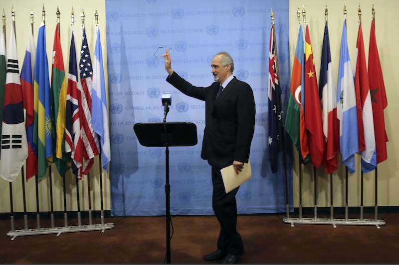 Syria's Ambassador to the United Nations Bashar Ja'afari speaks to reporters, Thursday, Sept. 12, 2013 at United Nations headquarters. (AP Photo/Mary Altaffer)