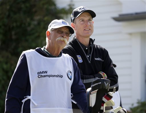 Jim Furyk, right and his caddie Mike "Fluff" Cowan look out from the third tee during the second round of the BMW Championship golf tournament at Conway Farms Golf Club in Lake Forest, Ill., Friday, Sept. 13, 2013. Furyk posted a single round 59, tying the PGA Tour record. (AP Photo/Charles Rex Arbogast)