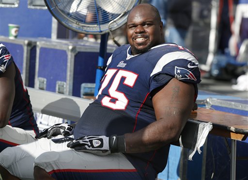 New England Patriots defensive tackle Vince Wilfork (75) watches from the bench in the second half of an NFL football game against the Tampa Bay Buccaneers on Sunday in Foxborough, Mass.