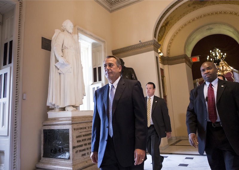 Speaker of the House John Boehner, R-Ohio, walks to the floor of the House as Congress continues to struggle over how to fund the government and prevent a possible shutdown, at the Capitol in Washington, Friday, Sept. 27, 2013.