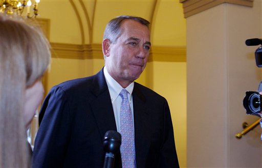 House Speaker John Boehner, R-Ohio, arrives at the U.S. Capitol in Washington today. Heat is building on balkanized Republicans, who are convening the House this weekend in hopes of preventing a government shutdown but remain under tea party pressure to battle on and use a must-do funding bill to derail all or part of President Barack Obama's health care law.