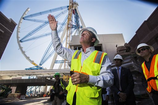 What will be the world's tallest observation wheel, know as the High Roller, is seen behind David Codiga, executive project director at The Linq construction site on Las Vegas Boulevard. The outer wheel of the 55-story High Roller ride is scheduled to be hoisted into place Monday.