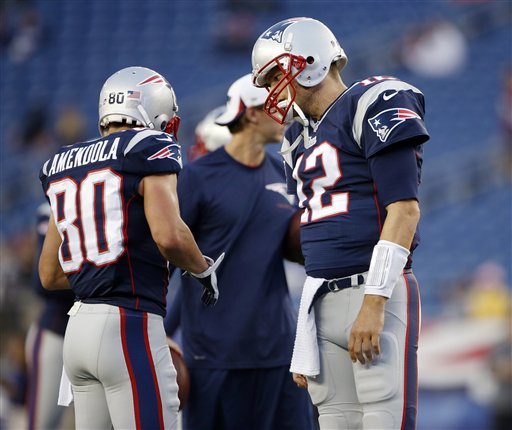 HEY, I’M TOM: New England Patriots quarterback Tom Brady, right, spent the preseason geting used to throwing to a number of new receivers, including Danny Amendola, left. Brady lost many of his favorite targets in the offseason, including Wes Welker, who signed with the Denver Broncos.