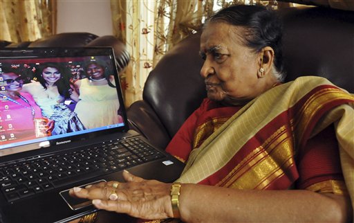 89-year-old Vege Koteshwaramma, looks at a photograph of her granddaughter Nina Davuluri, the first contestant of Indian origin to become Miss America, center on laptop screen, in Vijaywada, 174 miles east of Hyderabad, India, on Monday.