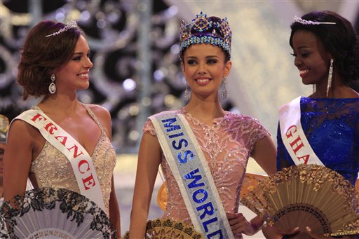 Newly crowned Miss World, Megan Young of the Philippines, center, with second runner-up, Miss France Marine Lorpheline, left, and third runner-up, Miss Ghana Carranza Naa Okailey Shooter, smile during the conclusion of the Miss World contest in Nusa Dua, Bali, Indonesia, today.