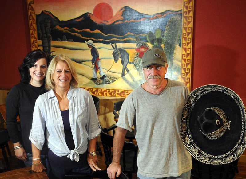 Jim and Deborah Remley are opening Bravo's Southwest Bistro in Hallowell with their daughter, Kate Remley, left. The family was working to prepare the restaurant today.