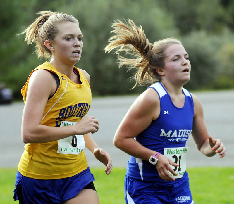 SHOULDER TO SHOULDER: Madison High School's Olivia Demchak, right, pulls ahead of Boothbay High School's Hannah Morley during a cross country meet Wednesday at the University of Maine at Augusta.