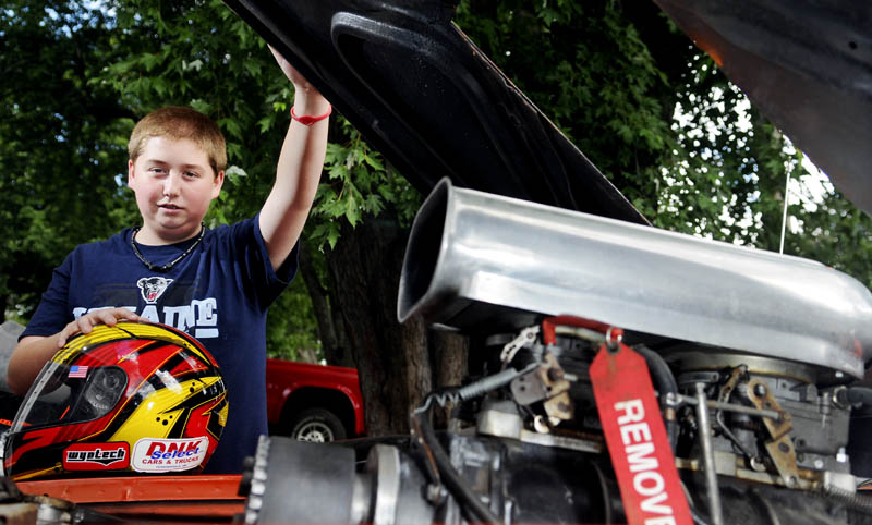 Cameron Folsom, 14, helped build and race a car to honor the memory of Jordan Ellis, 19, an Augusta teen who died of an apparent overdose in May. Folsom discussed the vehicle at his Augusta home on Thursday.