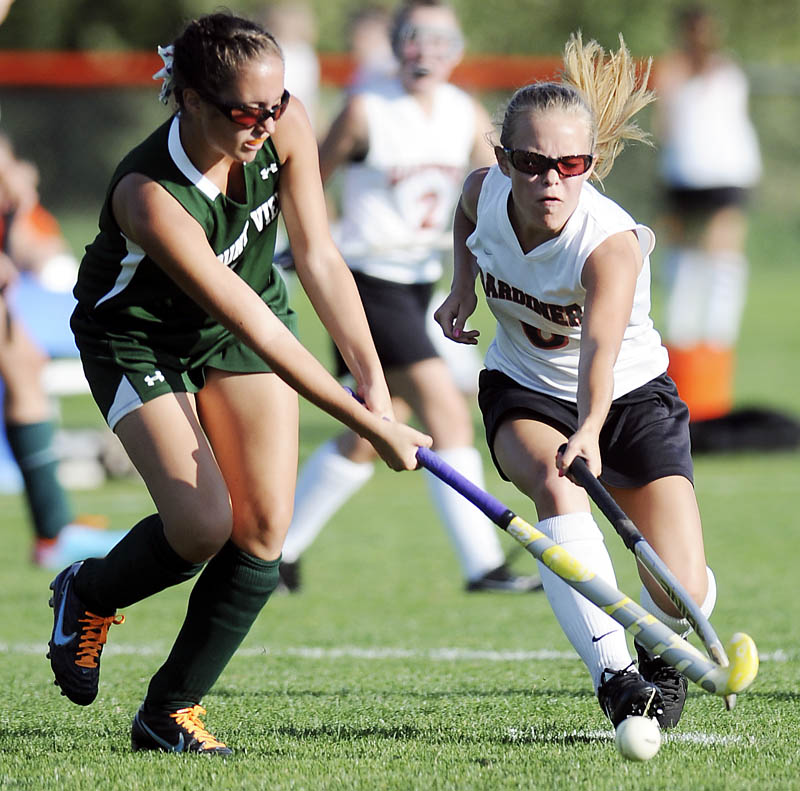 STICK WORK: Mount View's Brittany Moody, left, has a shot blocked by Gardiner's Emily Malinowski on Wednesday during a field hockey game in Gardiner. The Tigers won 5-2.