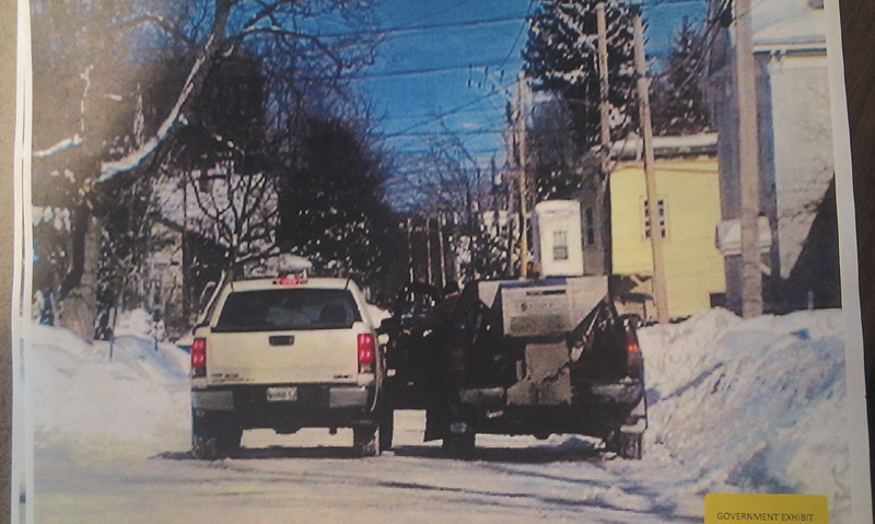 This photo taken by Kennebec County Sheriff’s Office Sgt. (now Deputy Chief) Ryan Reardon on Feb. 3, 2011, on Chapel Street in Augusta, Carole Swan’s white pickup is shown next to Frank Monroe’s plow/sand truck. Monroe is leaning out of the driver’s side of the door during the alleged payoff.