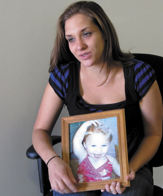 Trista Reynolds, 25, holds a photo of her 20-month-old daughter, Ayla Reynolds, during an interview with the Associated Press in Westbrook on Sept. 17. Reynolds, whose daughter went missing in December 2011, says she's going to release more information she's been told by investigations in hopes of calling attention to the case and bringing it to a resolution.