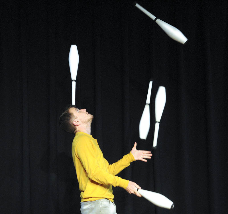 Shane Miclon rehearses a juggling act Thursday at Johnson Hall that he is scheduled to perform during the first showing of "The Early Evening Show With Mike Miclon" at the Gardiner theater on Saturday, Sept. 21. The spoof of late night talk shows, featuring local musicians, comedians, sketches and performers, has been running for 16 years with Shane's father, Mike, serving as the host. While most performances over the last 14 years at the Oddfellow Theater in Buckfield sold out, tickets are still available at Johnson Hall for the show on Saturday.