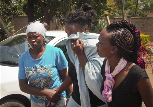 Karen Wambui, center, walks from the Nairobi city morgue Friday after confirming that the last body remaining at the morgue was her son, Calan Munyaka, 27, who was killed in the Westgate Mall attack, in Nairobi, Kenya. Karen Wambui identified her son as the last person to be confirmed killed during the recent al-Shabab terrorist assault on the Westgate Mall in Nairobi, Kenya on Sept. 21. Officials say at least 61 civilians and six security troops were killed in the four-day takeover of the mall by the al-Qaida-linked militant group.