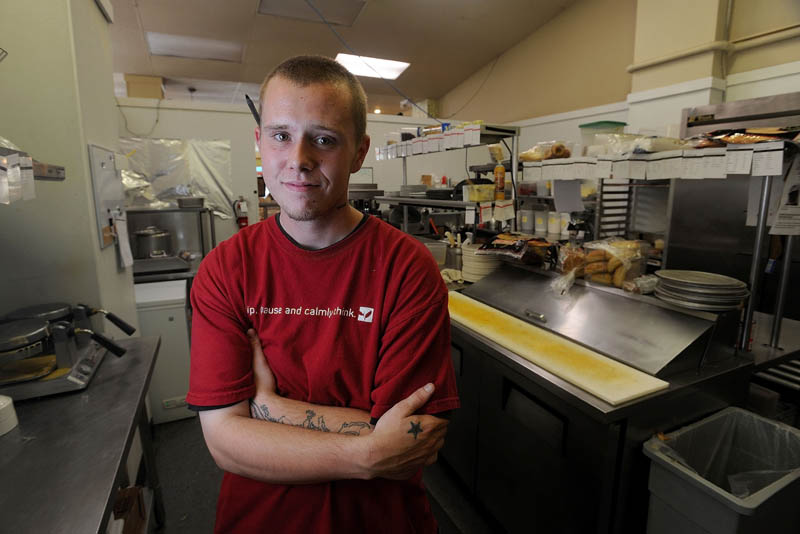 Evan McSwain, a cook at Selah Tea in downtown Waterville, has been uninsured for the last five years.