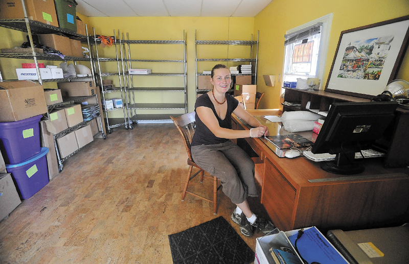 Sarah Smith sits at a desk at the Pickup Cafe in Skowhegan. The concept of the pop-up store is for a prospective retailer to try out the spot for a day, week or month.