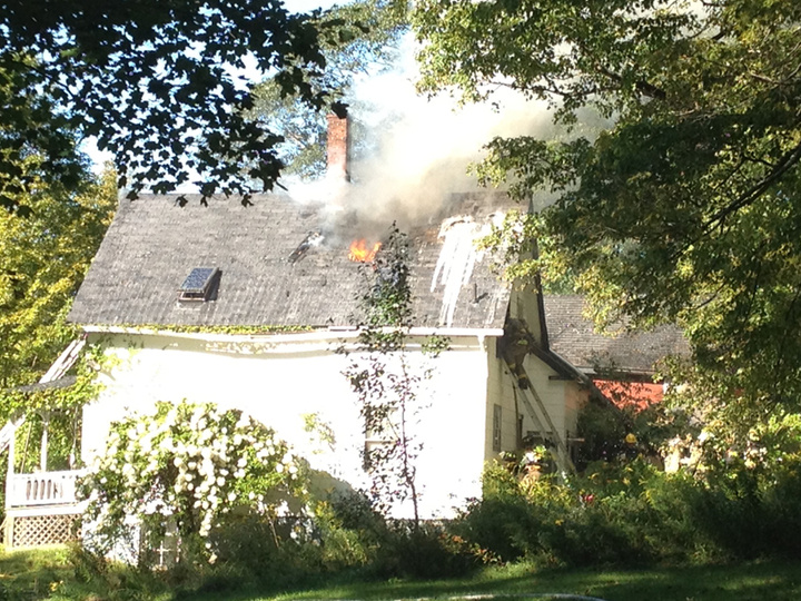 Firefighters battle a blaze at a home near the intersection of Webb Road and Route 126 in Pittston Friday afternoon.