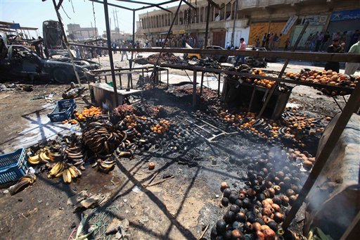 Remains of fruit smolder at the site of a car bomb attack at a vegetable market in Basra, 340 miles southeast of Baghdad on Sunday.