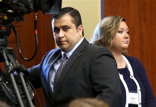 George Zimmerman arrives in Seminole circuit court with his wife, Shellie, in this June 24, 2013, photo.