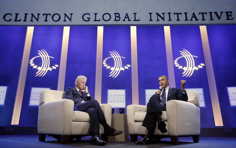 President Barack Obama, right, with former President Bill Clinton, left, speaks at the Clinton Global Initiative in New York, Tuesday, Sept. 24, 2013.