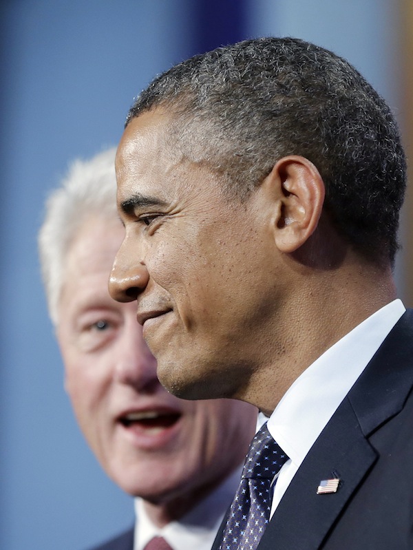 President Barack Obama, right, on stage with former President Bill Clinton, left, after speaking at the Clinton Global Initiative in New York, Tuesday, Sept. 24, 2013. (AP Photo/Pablo Martinez Monsivais)