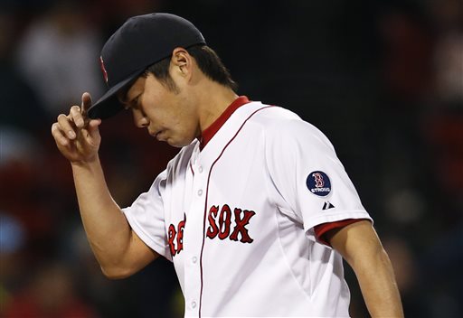 Boston Red Sox closer Koji Uehara reacts after giving up a run to the Baltimore Orioles in the ninth inning of a baseball game at Fenway Park in Boston, Tuesday, Sept. 17, 2013. The Orioles won 3-2. (AP Photo/Elise Amendola) Fenway Park