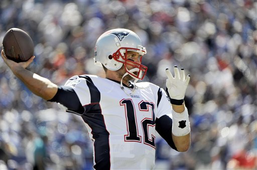 New England Patriots quarterback Tom Brady warms up along the sidelines at halftime during an NFL season opener against the Buffalo Bills Sunday, Aug. 8, 2013, in Orchard Park. (AP Photo/Gary Wiepert)